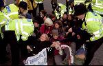 Crowd starts to lock arms