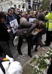 Anti war protesters lay flowers at cenotaph