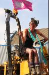 Woman on tractor during march