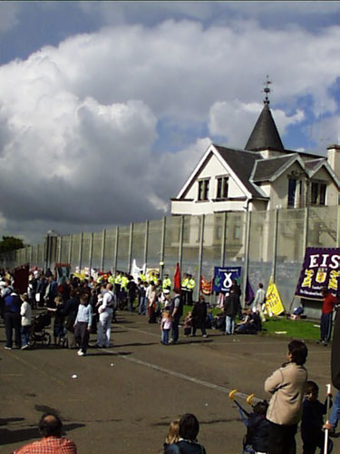 the fence and the detention centre- more ugly buildings at the back...