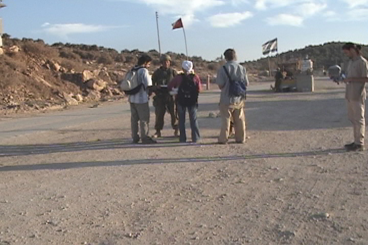 Internationals approach the soldiers at Awarta checkpoint