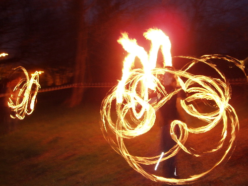 Fire twirlers in the park