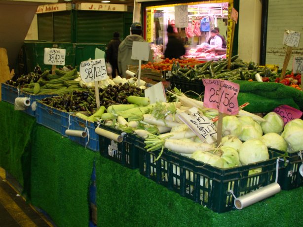 fruit and vegetable stalls in Queens Market