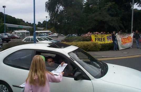 A young activist giving out leaflets