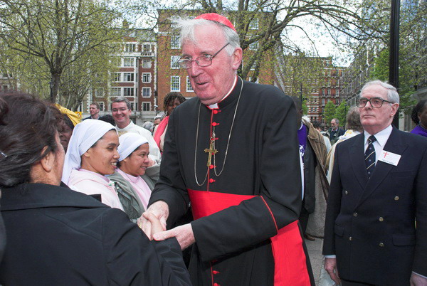 The Cardinal greets people outside the cathedral