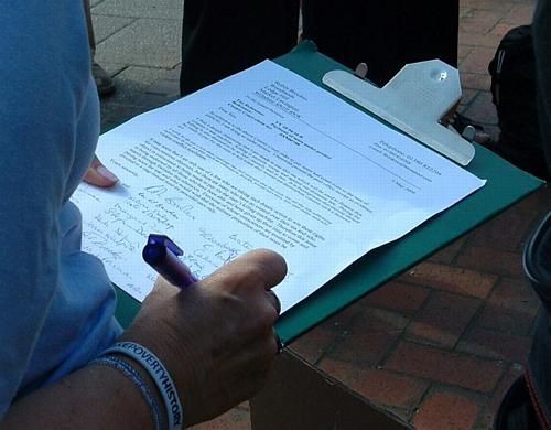 Supporters sign the letter of protest