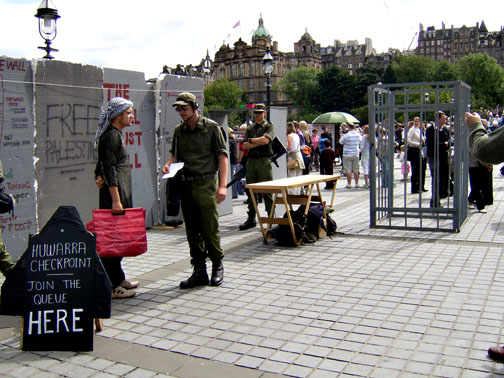 The checkpoint, wall and detention pen.