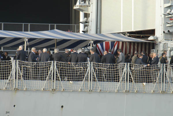 Drinks and nibbles aboard British warship moored outside arms fair