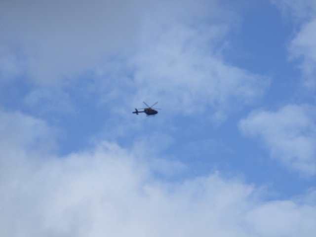police helicopter hovering over the camp