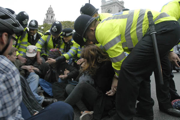 Sit down protest moved by police