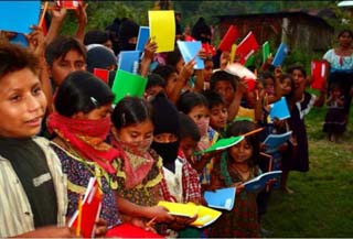 Zapatista Children with new school books Photograph: A. Conde, M. Reilly and M-S