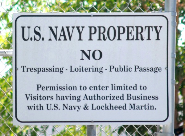 Signs indicate that Lockheed Martin Building 181 is U.S. Navy property