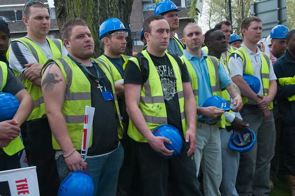 Building workers listen at Stratford 3