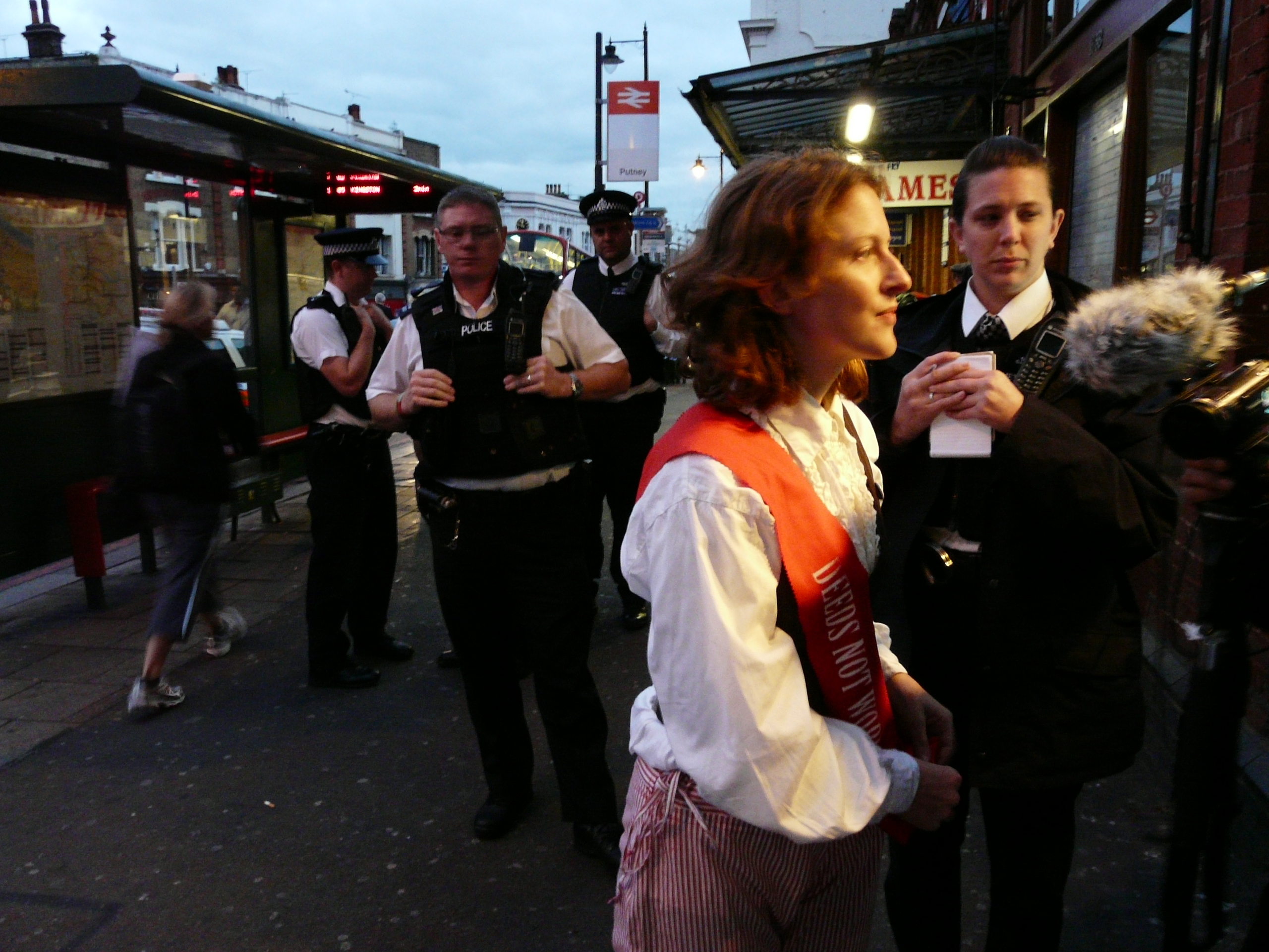 Climate Suffragette, Deborah Grayson, is questioned by police.