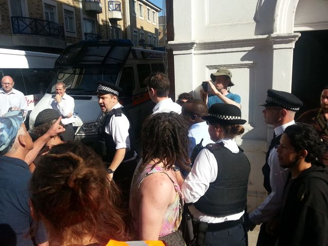 Two councillors get escorted away by police to chants of "Scum"!