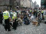 Sit down at the junction of the Royal Mile, North and South Bridges.