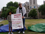 edwin and friend with banner in the square