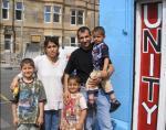 Temal family safely back in Glasgow outside the Unity Centre
