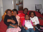 Evariste and his family at their home in Glasgow