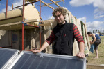 Mark with the soon-to-be-completed solar hot showers.