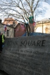 Bonn Square sign with a view of the tree house