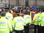 Cops surrounding and pressuring pro Tibetans off the pavement