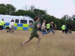 police vans drive on to site