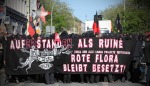 banner in solidarity with flora and zomia