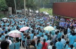 Striking workers rally outside the Guangzhou handbag factory