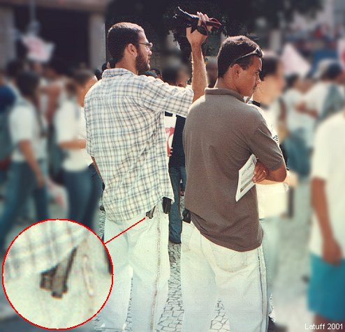 Infiltrated policemen during demonstrations in Brazil (photo by Latuff)