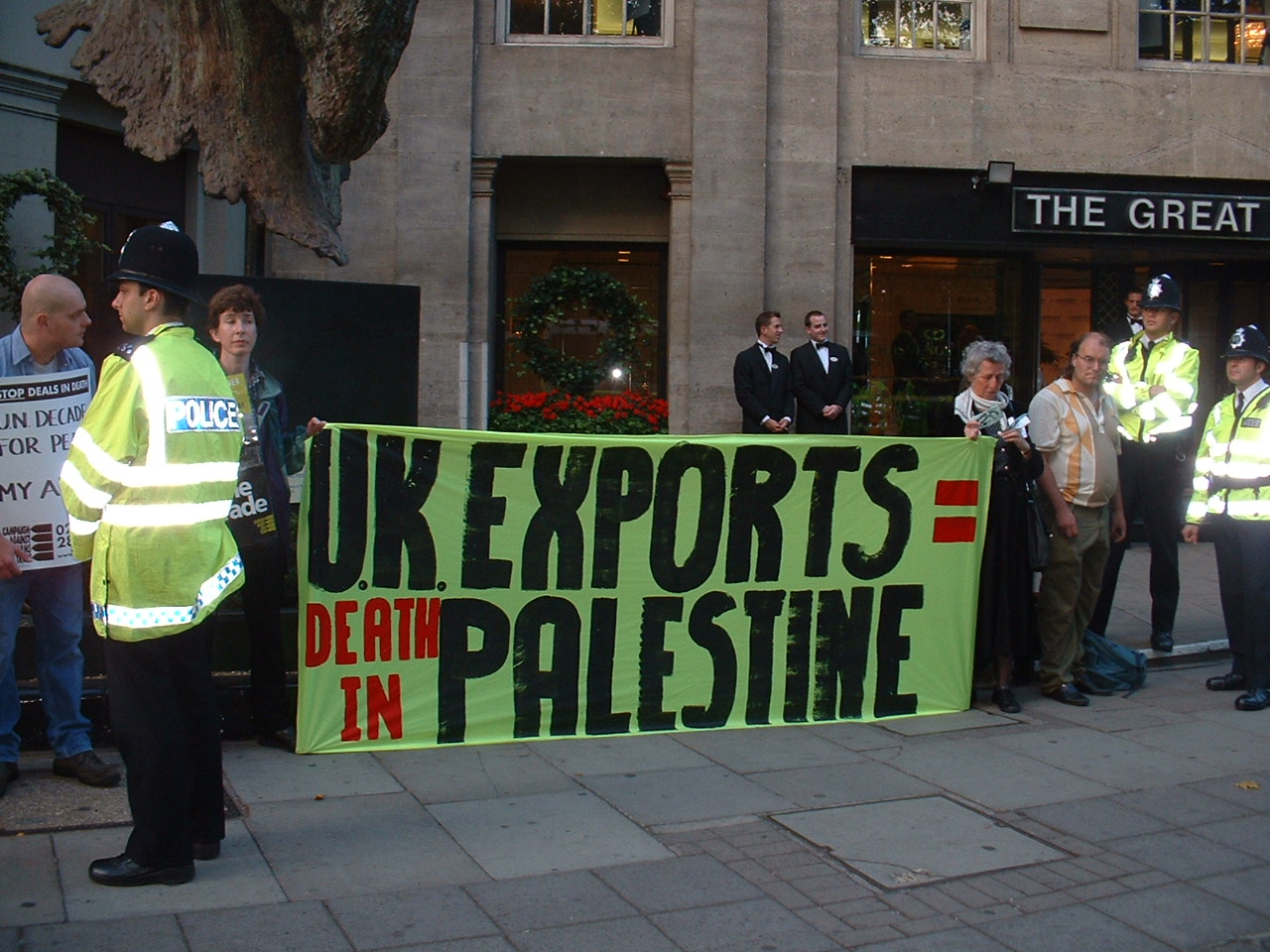 3 ARRESTED AFTER DISRUPTING ARMS FAIR DINNER