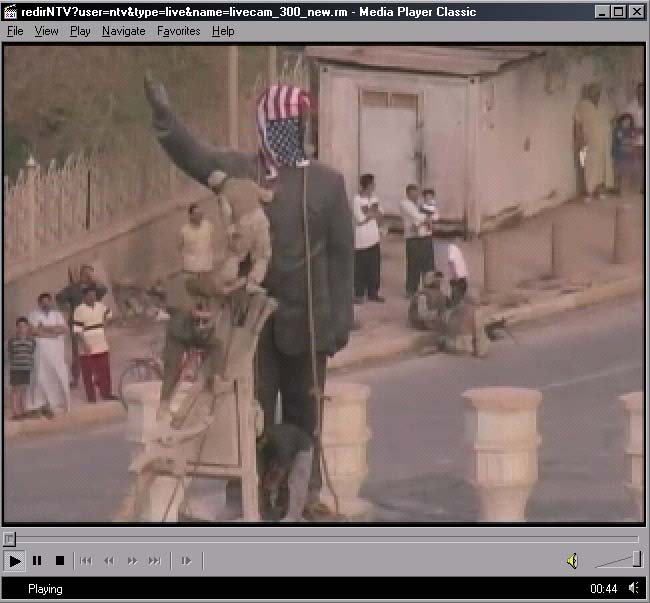 US Army puts it's flag on statue of Saddam