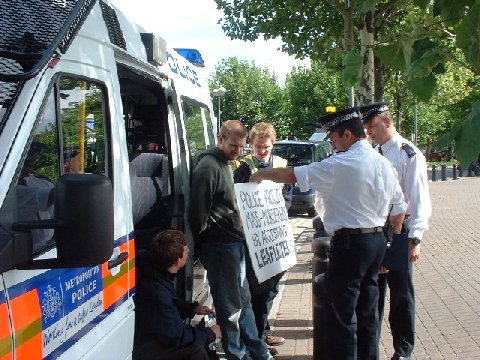 Police admire a placard