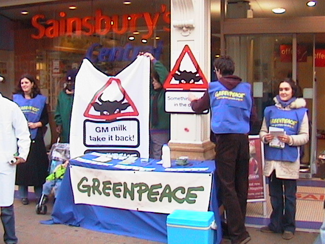 Activists at Greenpeace stand