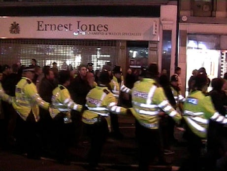 heavy cordon escorts protestors along oxford street