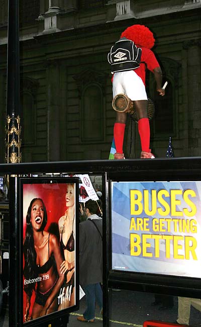 Mad jembe man on bus shelter