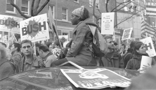 girl sitting above the crowd