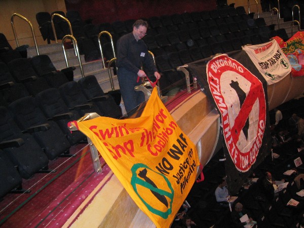 displaying the Swindon Stop the War banner in the conference hall.