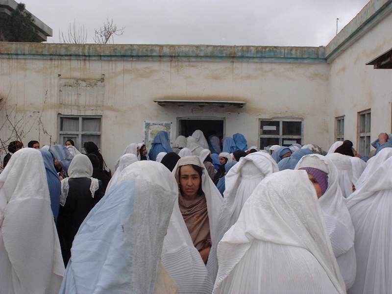 Women crowd the registration site