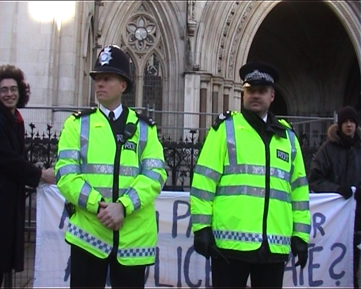 cops in front of banner