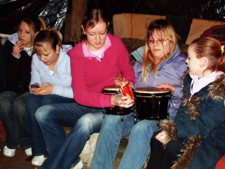 Local kids enjoy the warm fire in the communal lounge.