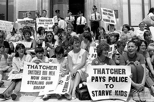 Women and children demonstrating against £15 being deducted from striking miners