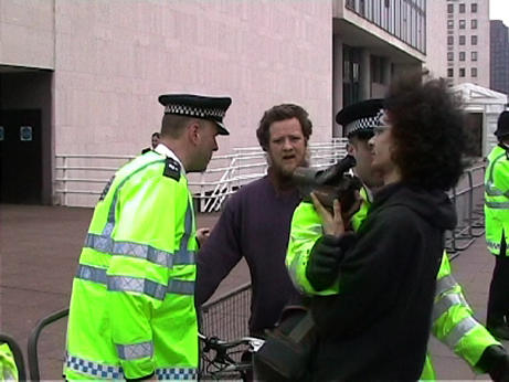 despite their own surveillance operation, police seemed curiously camera-shy