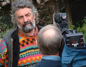 Tony Wrench interviewed for TV outside his now occupied house.