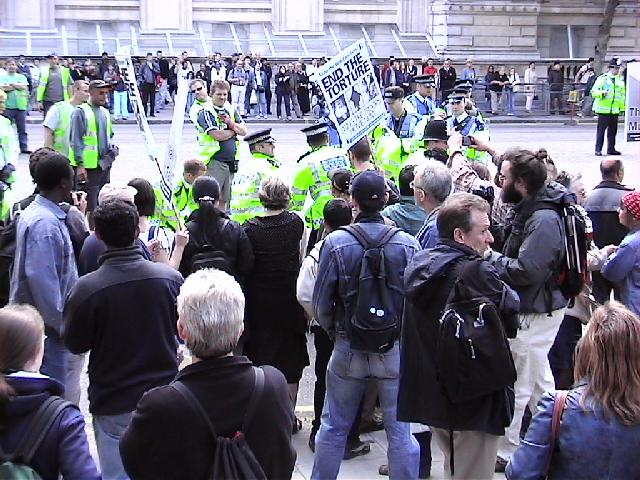 Police drag people away from the sit down protest