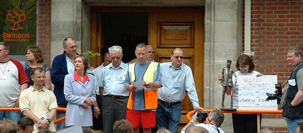 Speakers on the steps of Swindon Borough Council civic offices