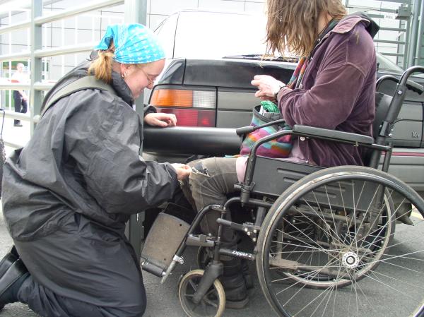 protesters leaving after long time of lock-on arm to arm in black tube
