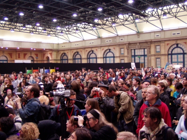 large audience listens attentively