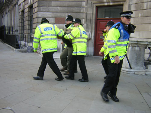 IMC-UK activist being arrested