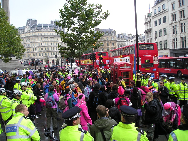 Police surrounding celebrators in Trafalgar Square.